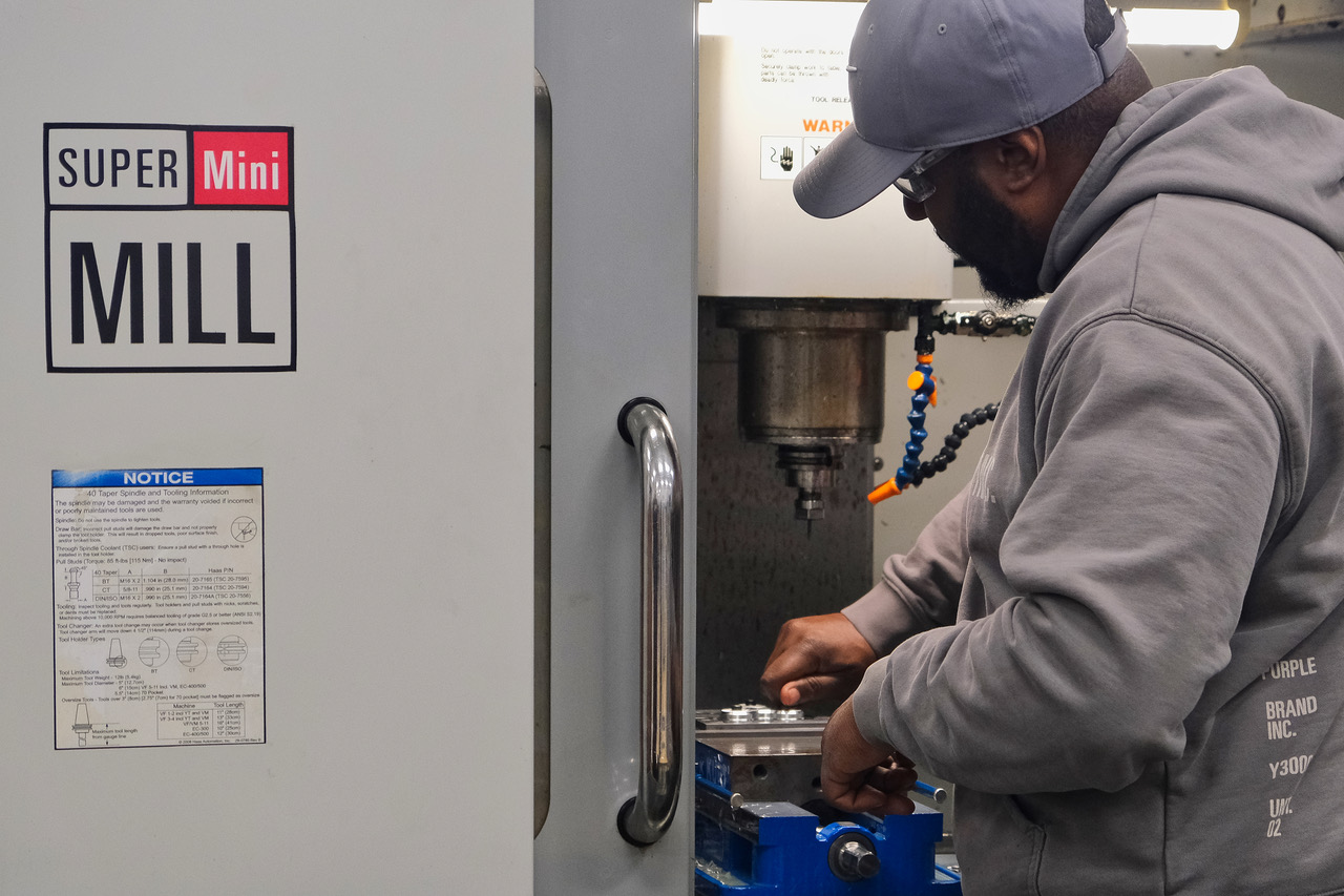 Student working with machine