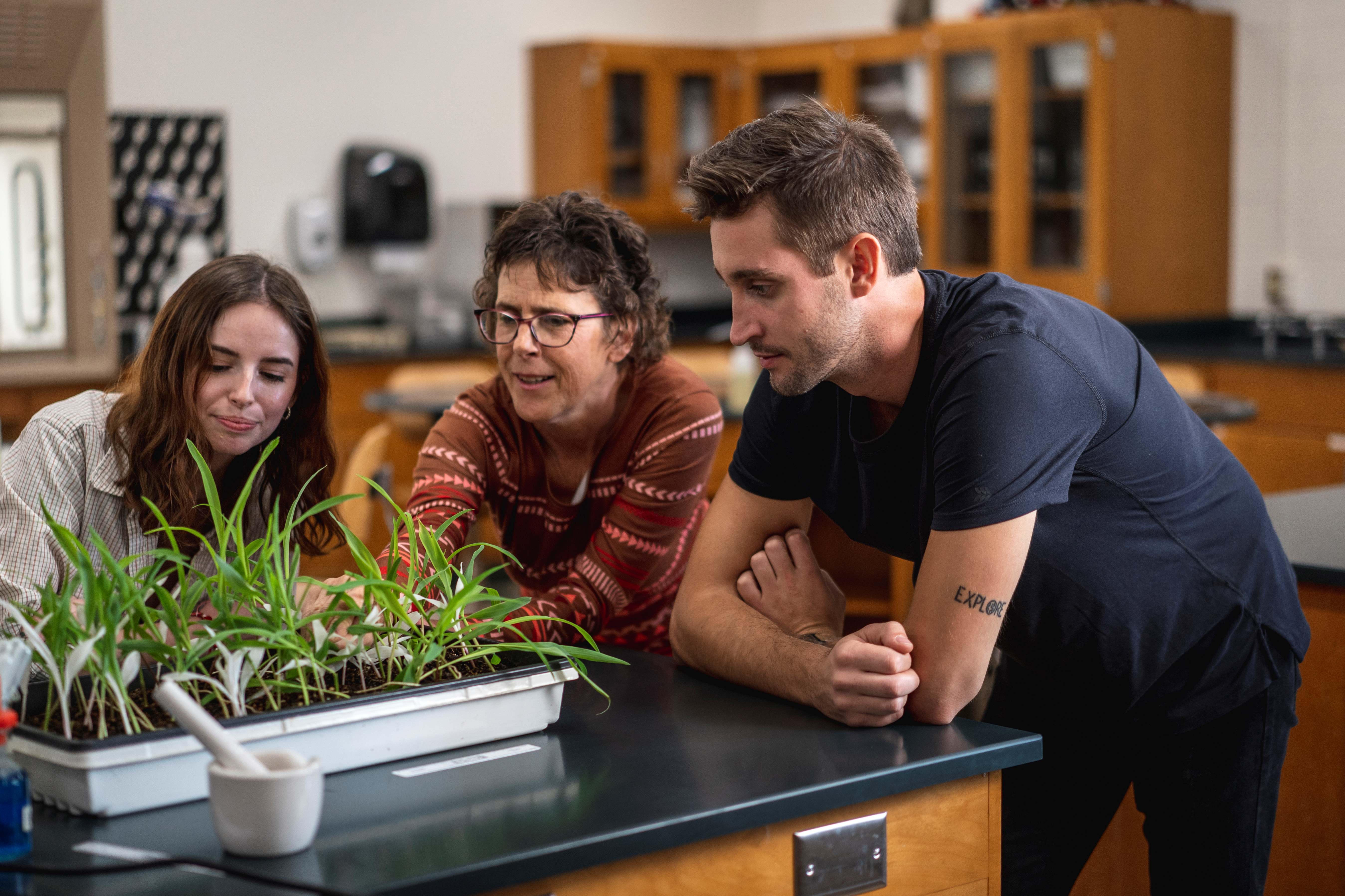 Student and instructor in biology lab