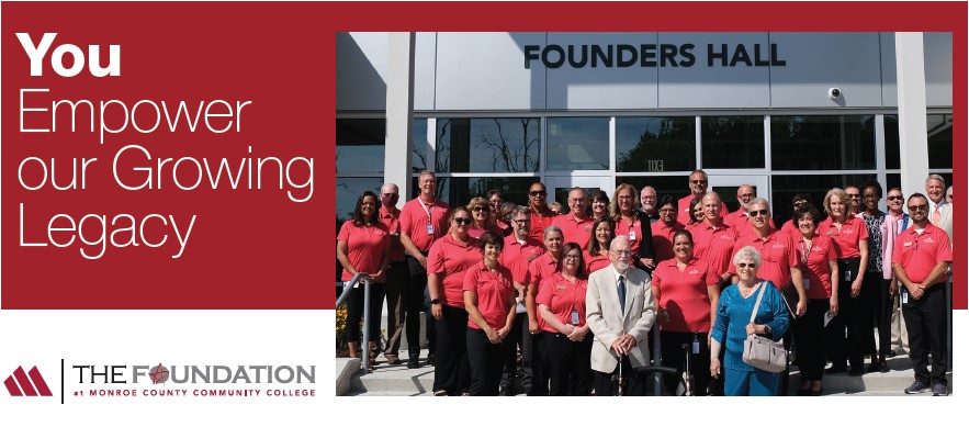 Employees in front of Founders Hall with Retirees