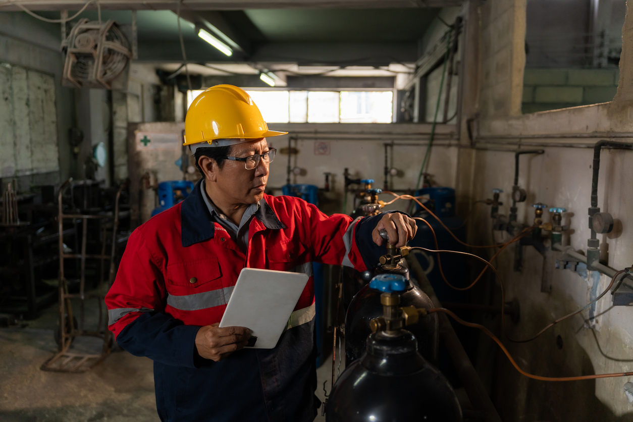 Man checking out geothermal unit