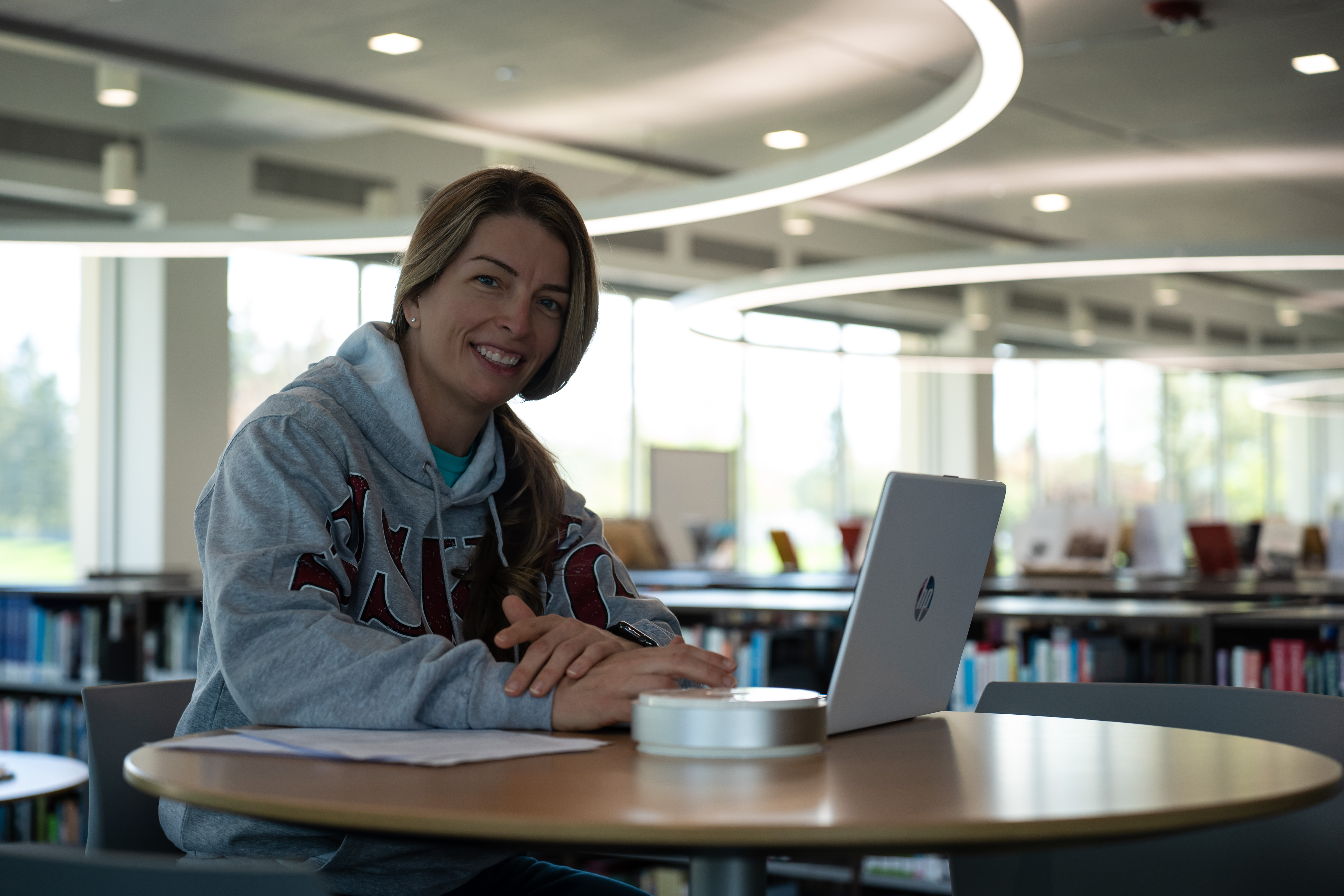 student in library at computer