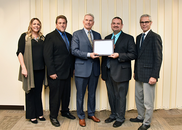 MCCC officials holding award