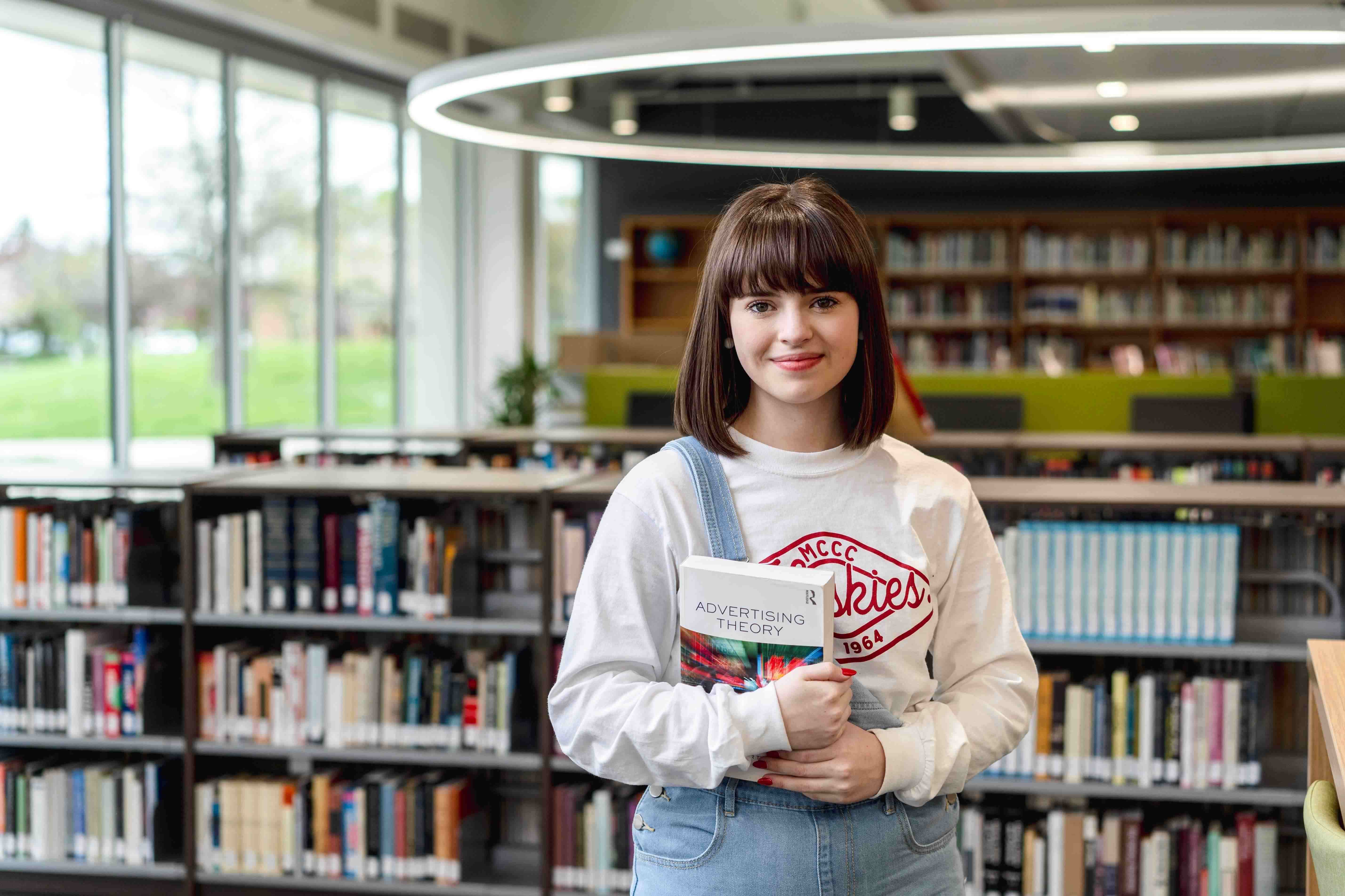 Student in Library: Reese Johnson