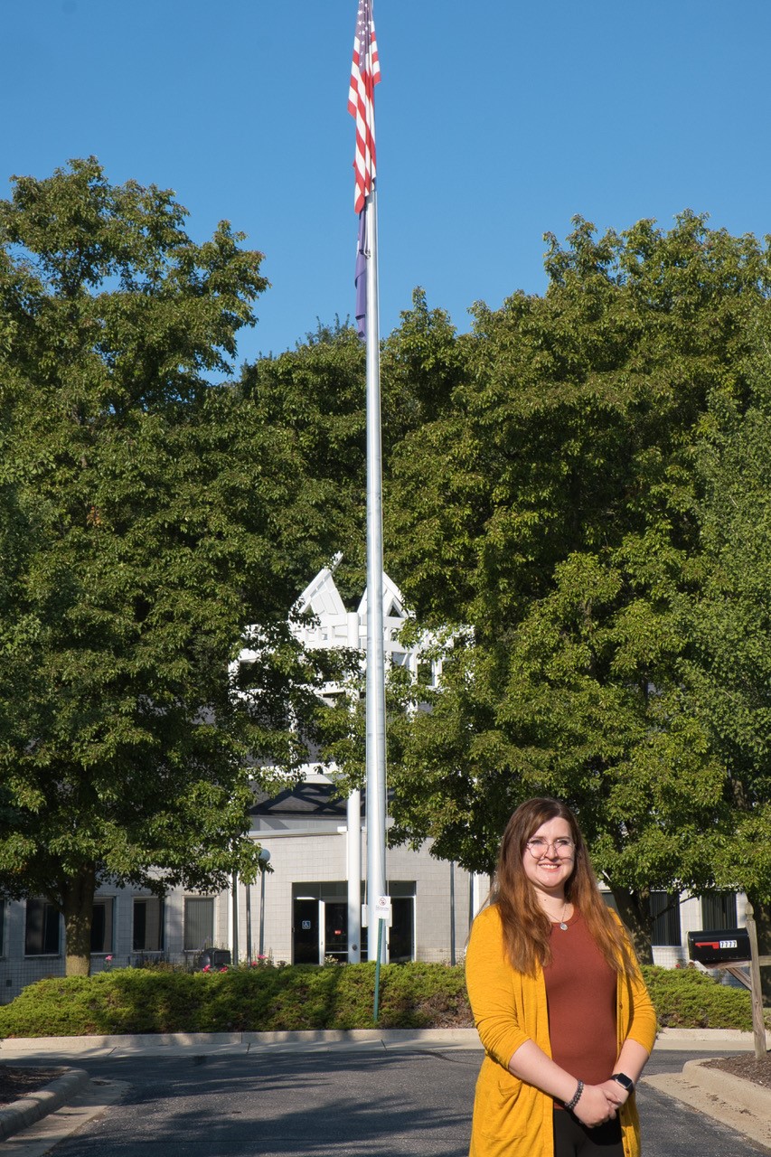 MCCC Whitman Center Coordinator Rebecca Fournier in front of the facility