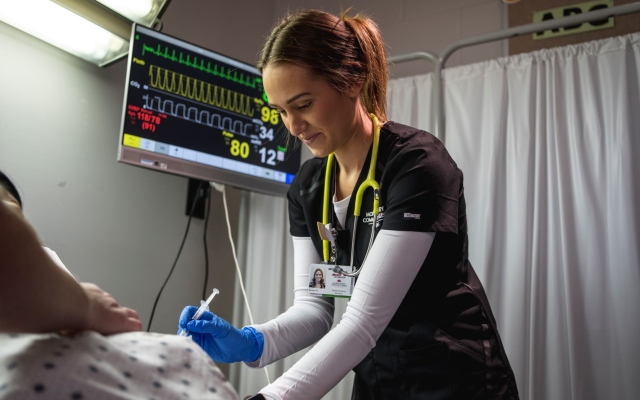 MCCC nursing student helping patient