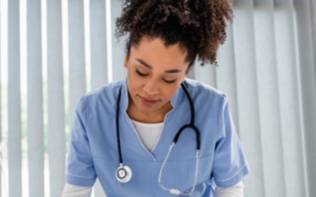 Image of nurse and patient