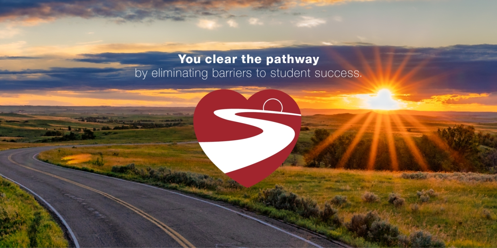 Sunset over a winding road. Text is: "You clear the pathway by eliminating barriers to student success."
