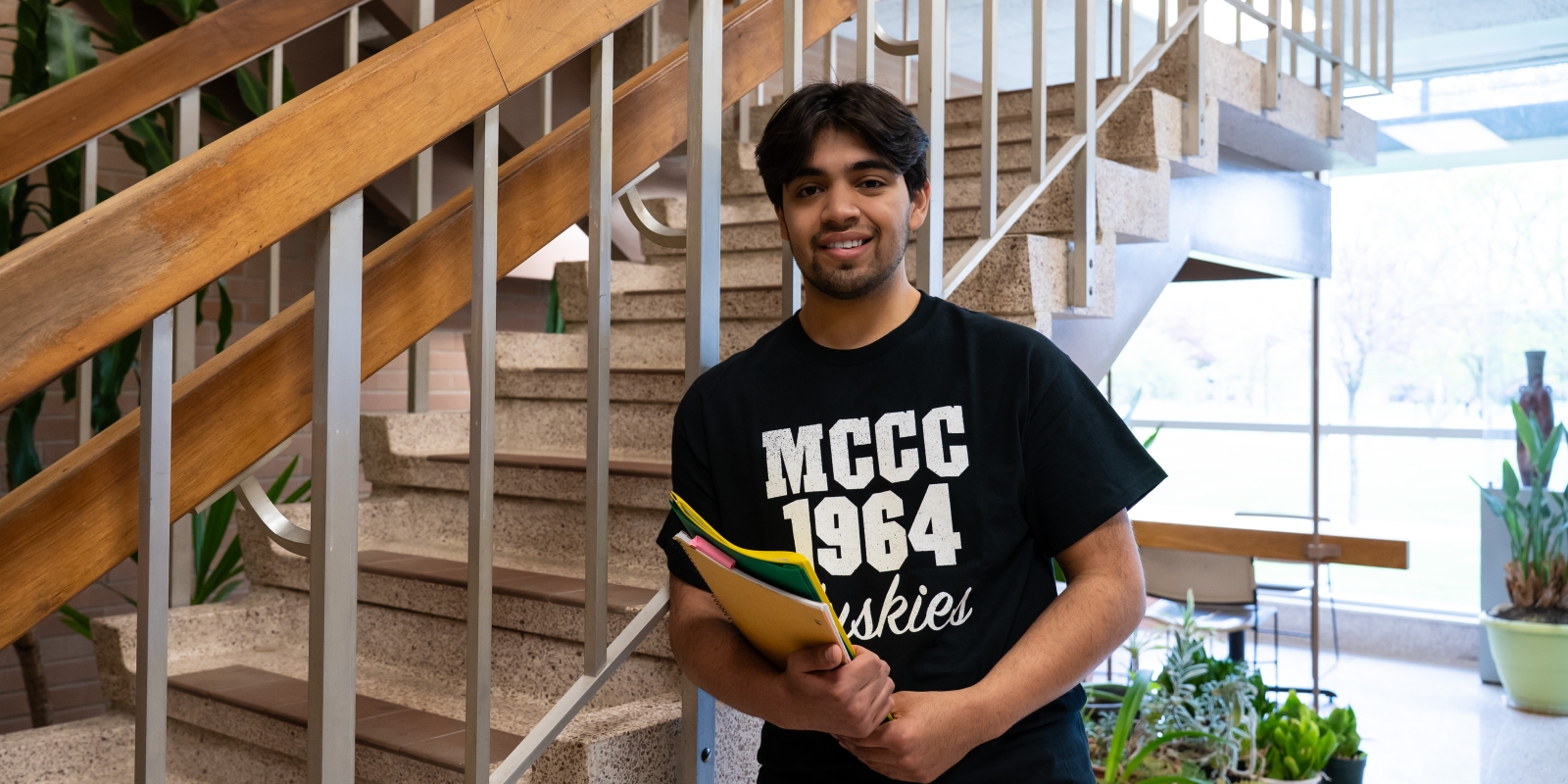 Student near stairwell in Life Science Building