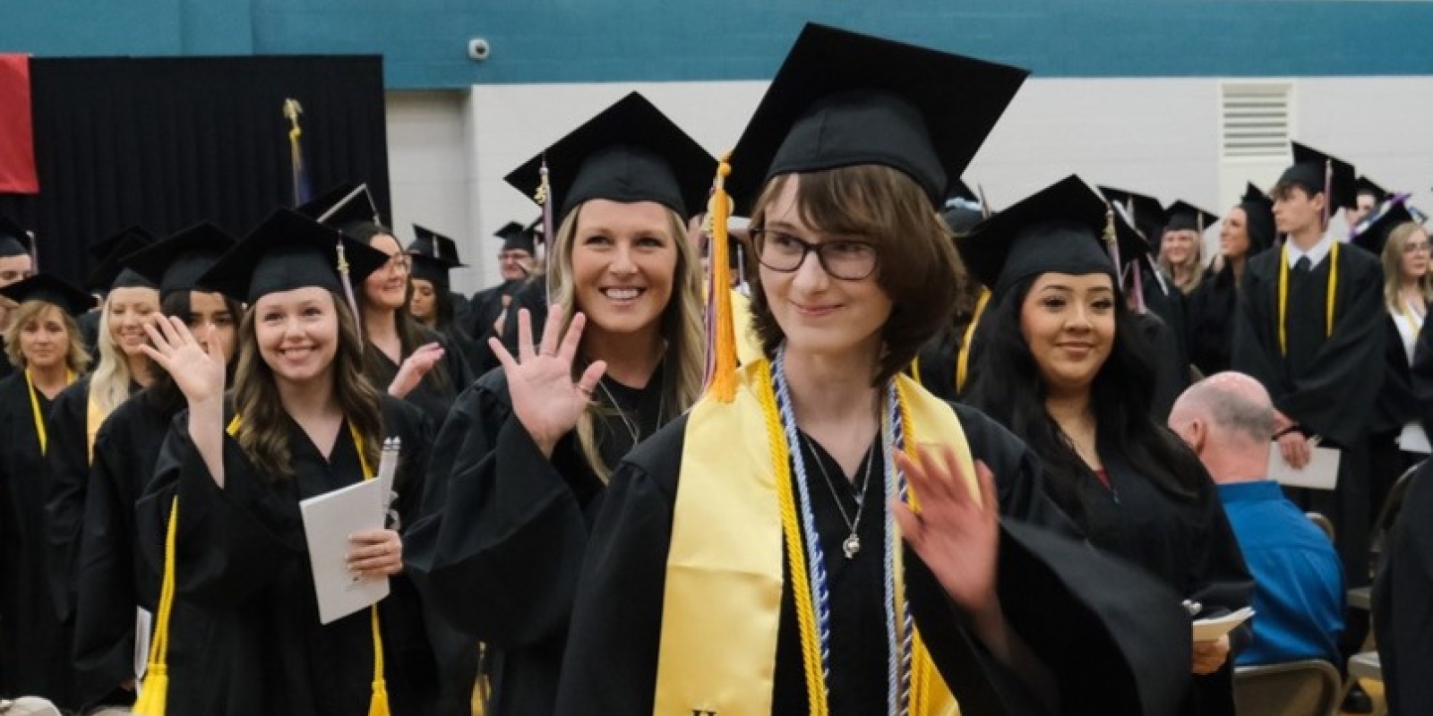 Grads waving
