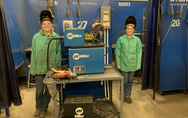 two female welding students
