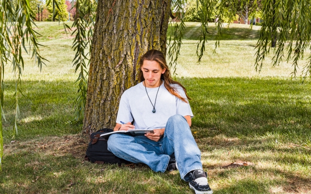 Student by tree