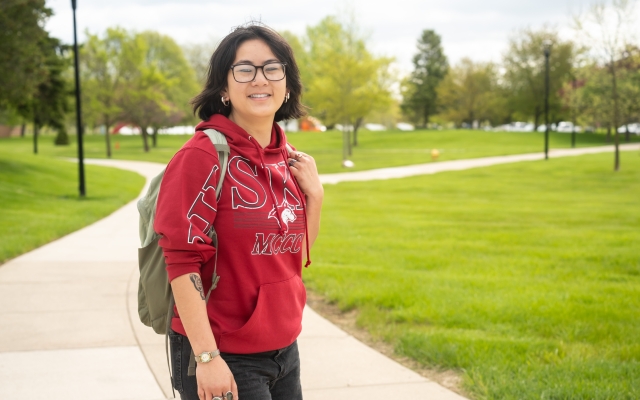 Female student outside with back pack