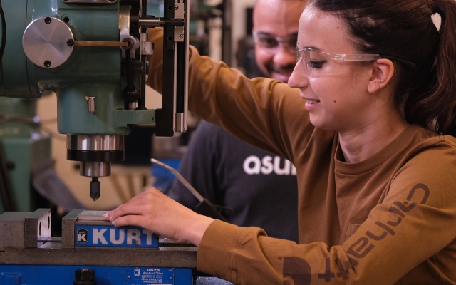 Female working a machine